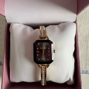 Elegant Gold and Black Watch by Ellen Tracey